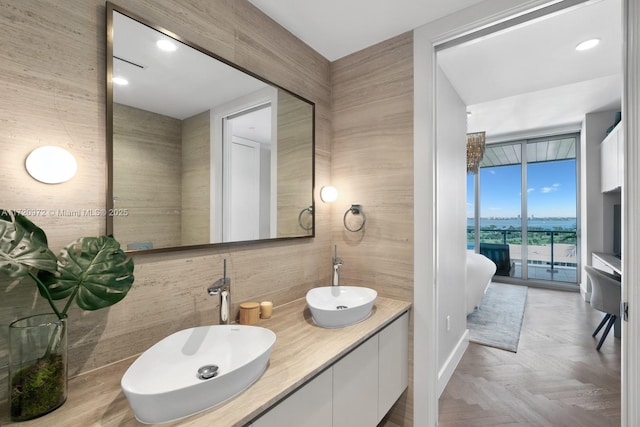 bathroom with vanity and parquet flooring