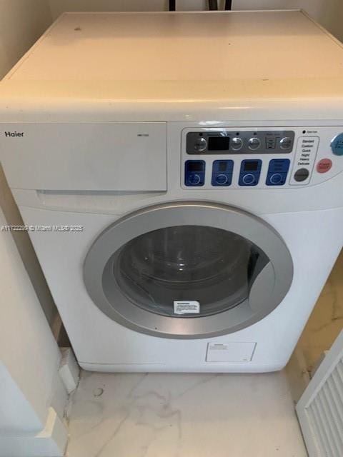 laundry room featuring washer / dryer