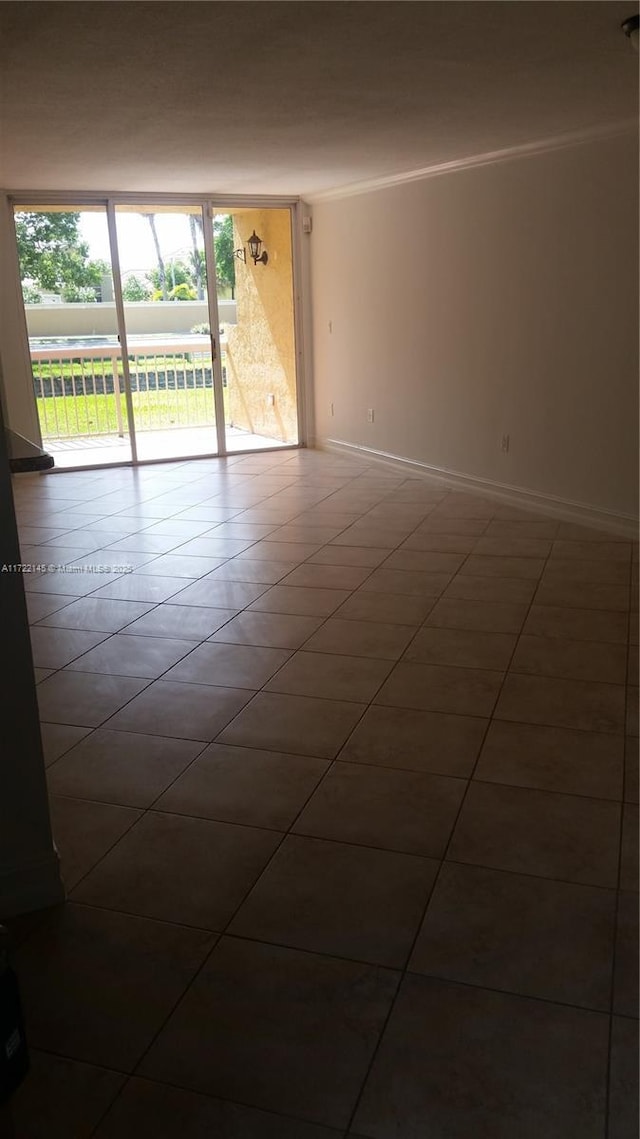 tiled empty room with ornamental molding