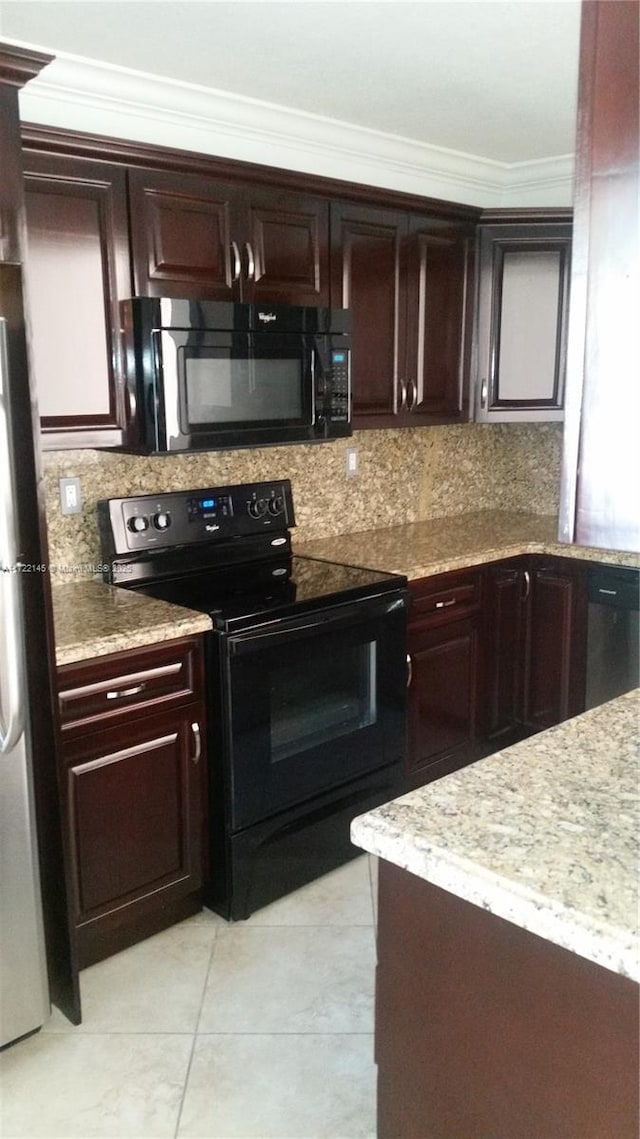 kitchen with light tile patterned flooring, decorative backsplash, ornamental molding, and black appliances