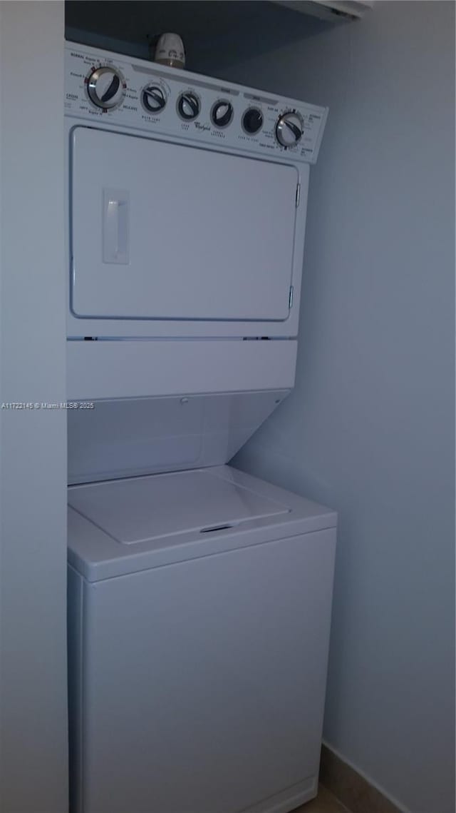 washroom with stacked washer / dryer