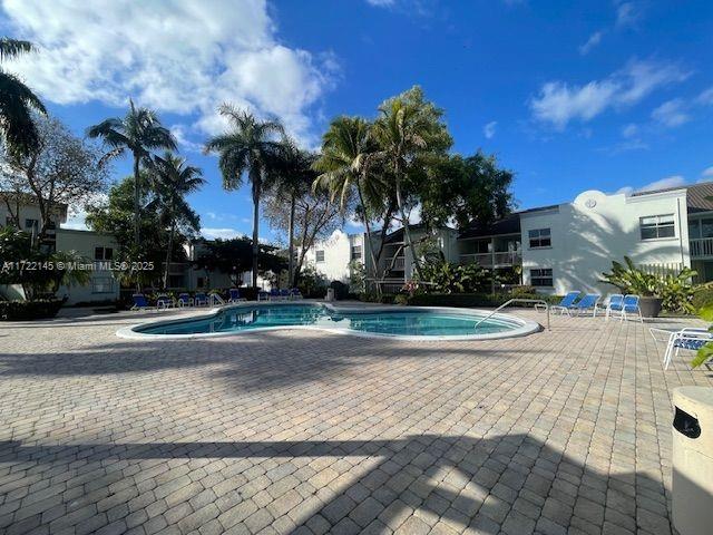 view of swimming pool with a patio