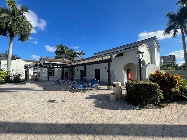 back of property with a patio area