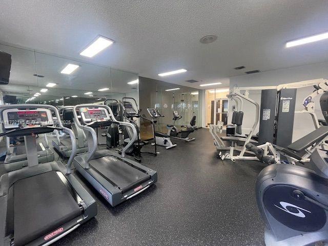 workout area with a textured ceiling