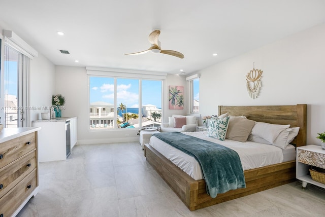 bedroom with ceiling fan and sink