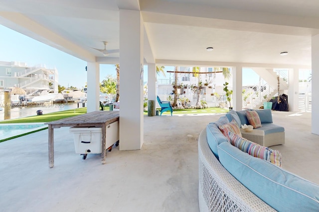 view of patio with a water view and an outdoor hangout area