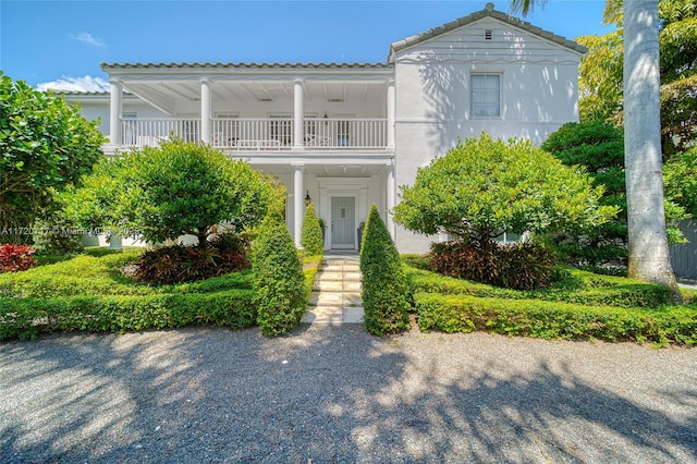 view of front of house with a balcony