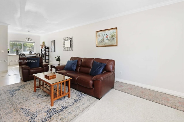 carpeted living room featuring ornamental molding and an inviting chandelier