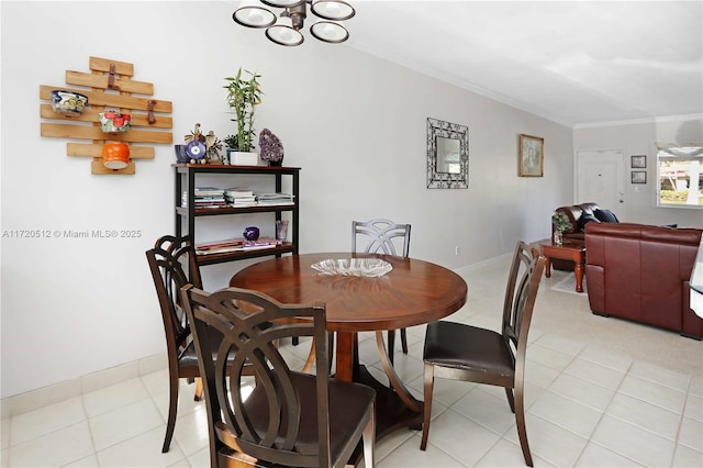 dining space featuring crown molding