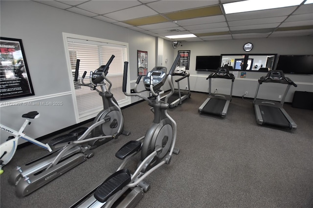 gym featuring a paneled ceiling