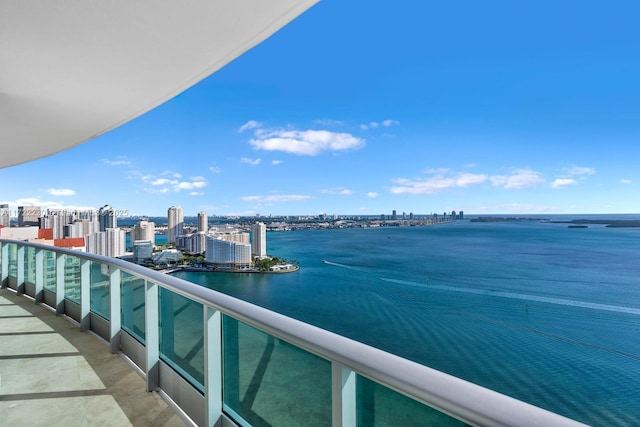 balcony featuring a water view