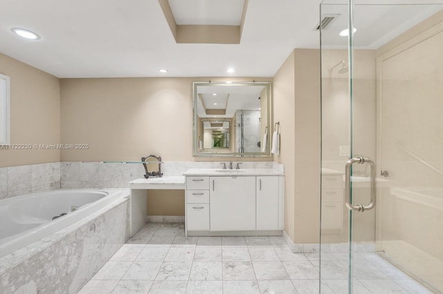 bathroom with vanity and independent shower and bath