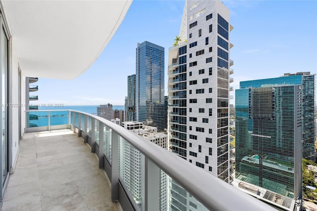 balcony featuring a water view