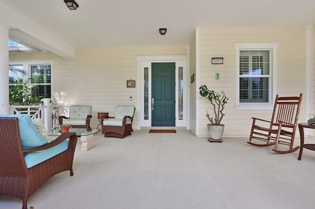 doorway to property featuring covered porch