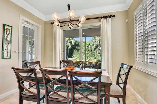 dining space featuring a chandelier, light tile patterned flooring, crown molding, and baseboards