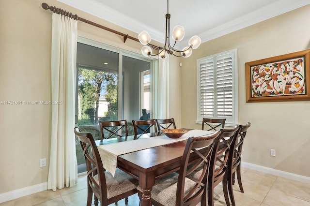 dining area with light tile patterned floors, ornamental molding, and an inviting chandelier