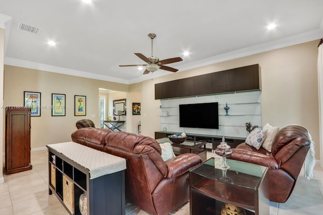 living room with ceiling fan, light tile patterned floors, and ornamental molding