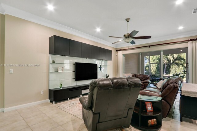 living room featuring ceiling fan, crown molding, and light tile patterned flooring