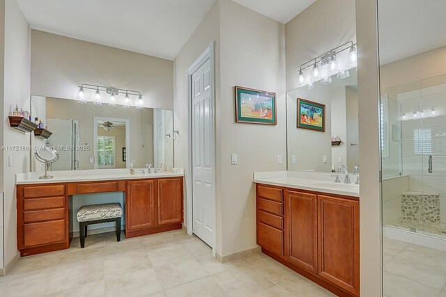 bathroom with tile patterned floors, ceiling fan, vanity, and walk in shower