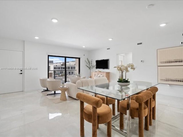 dining space with recessed lighting and visible vents