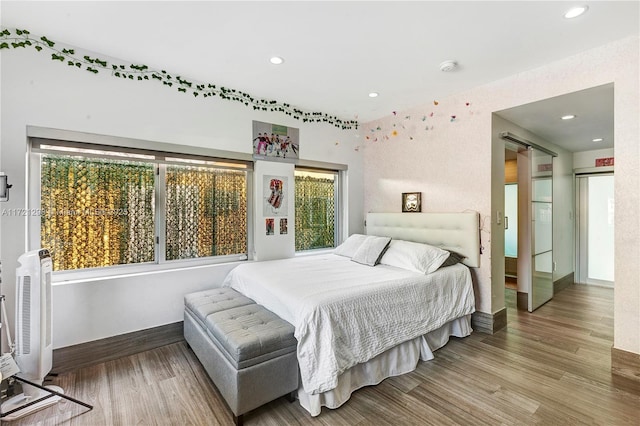 bedroom featuring hardwood / wood-style floors