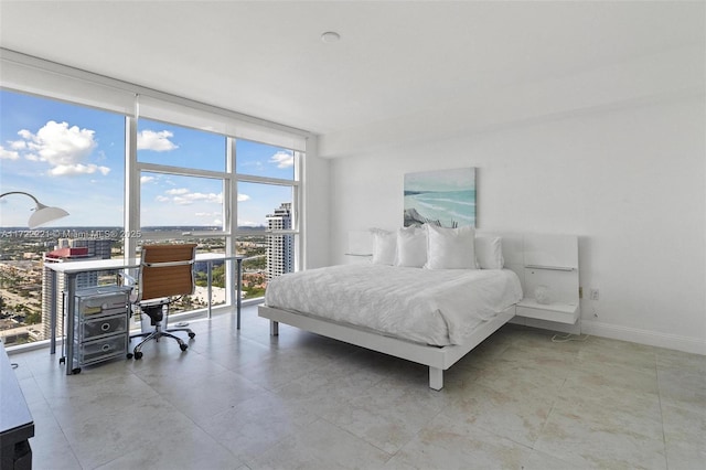 bedroom featuring a wall of windows