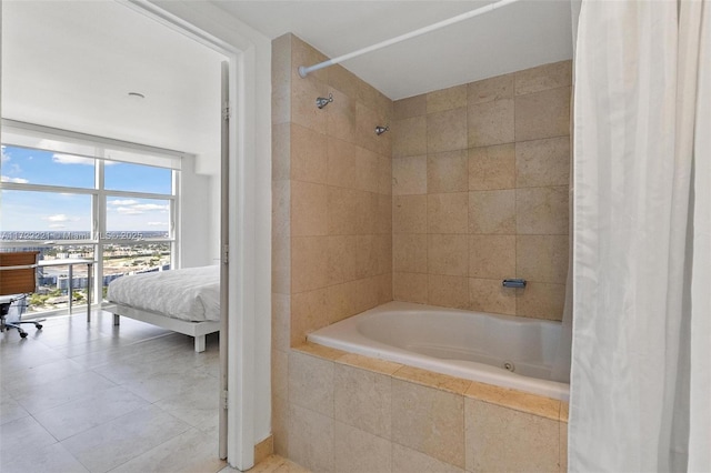 bathroom with shower / bathtub combination with curtain and a wall of windows