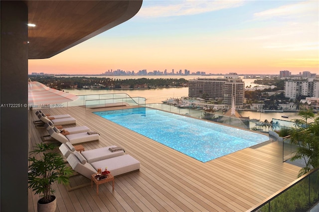 pool at dusk with a water view