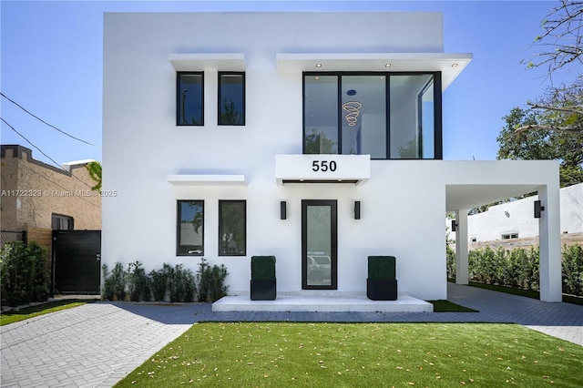 modern home featuring a front yard