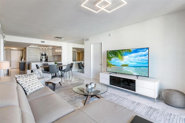 living room featuring a textured ceiling