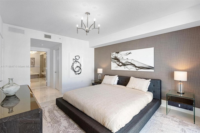 bedroom with a chandelier and ensuite bathroom