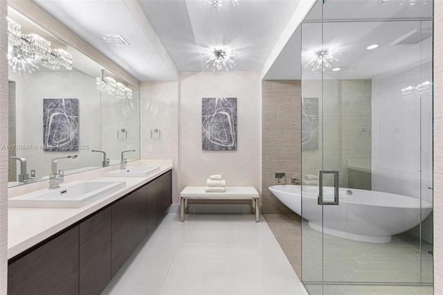 bathroom with tile patterned floors, vanity, separate shower and tub, tile walls, and a chandelier