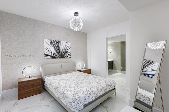 bedroom with ensuite bathroom and a chandelier