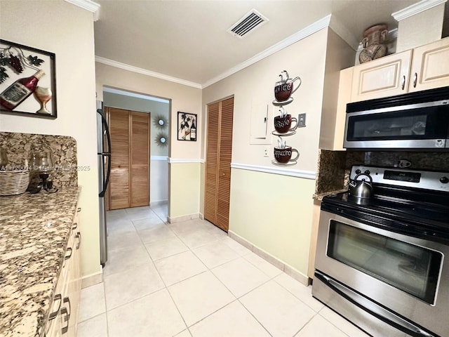 kitchen featuring crown molding, light tile patterned flooring, stainless steel appliances, and light stone counters