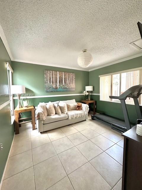 tiled living room with crown molding