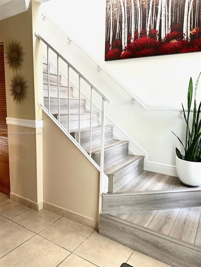 stairs with tile patterned flooring