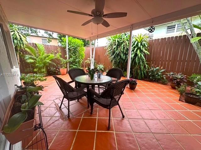 view of patio / terrace featuring ceiling fan