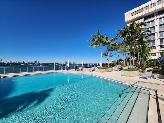 view of swimming pool with a patio