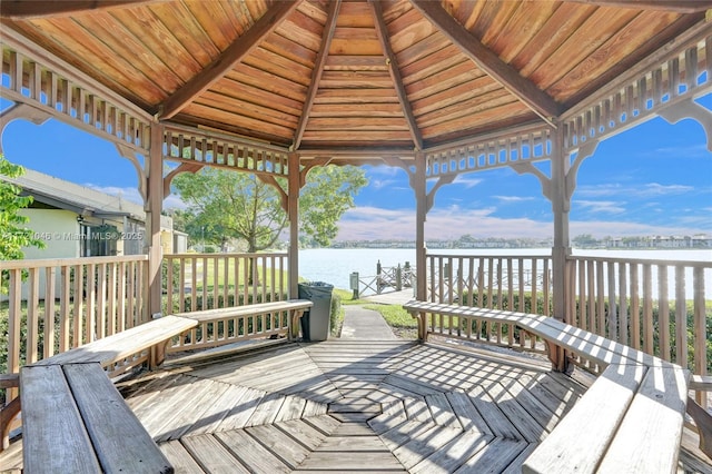 wooden deck featuring a gazebo and a water view