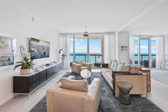 tiled living room featuring floor to ceiling windows