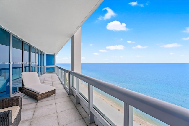 balcony with a view of the beach and a water view