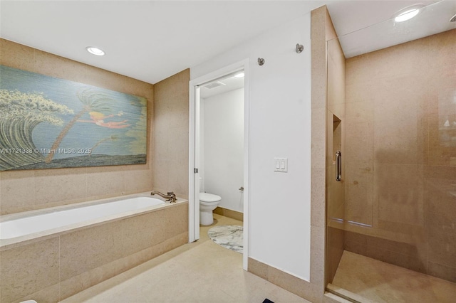 bathroom with separate shower and tub and toilet