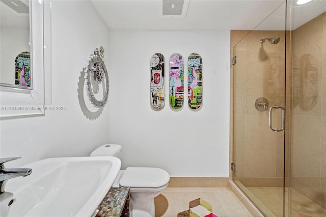 bathroom with tile patterned flooring, toilet, an enclosed shower, and sink