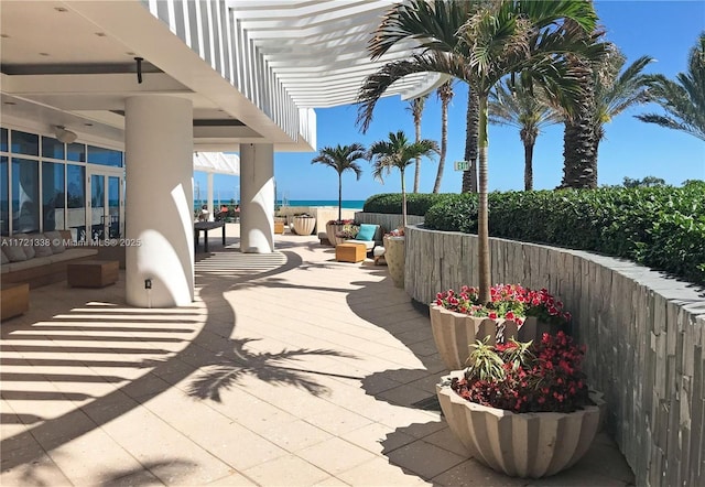 view of patio / terrace featuring outdoor lounge area and a water view