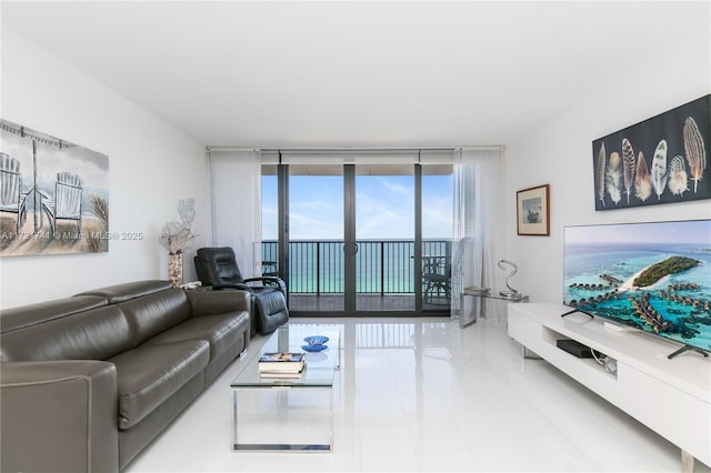 living room with light tile patterned floors and expansive windows