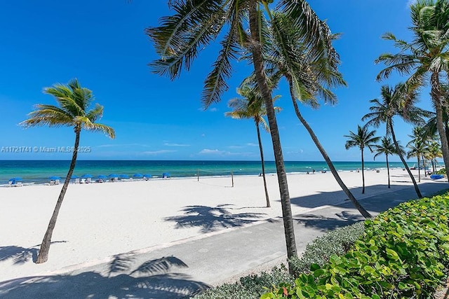 property view of water featuring a beach view