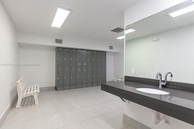 bathroom with tile patterned floors and sink