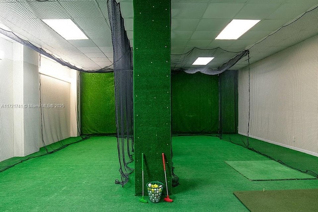 basement featuring carpet flooring and a drop ceiling