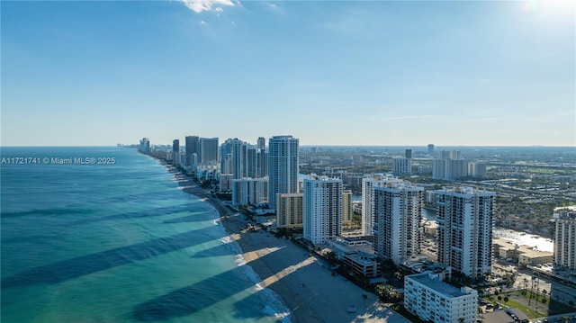 aerial view featuring a view of the beach and a water view