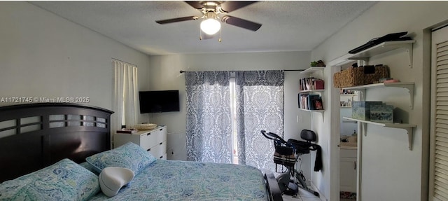 bedroom featuring a textured ceiling and ceiling fan